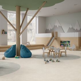 Light coloured cement effect flooring in a children's nursery school setting