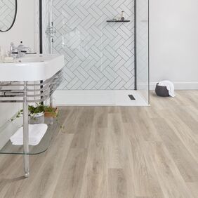 Bathroom, clear glass shower, tiles, mirror, sink 