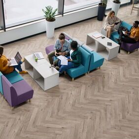 Oak effect flooring in parquet style laid in a commercial office space
