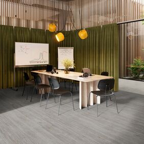 Grey coloured oak effect flooring laid in a meeting room space