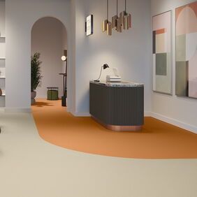 orange and cream floor in a bag shop, green chair, retail 