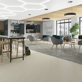 Light stone and silver oak wood effect flooring in a break time area 