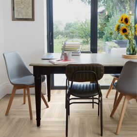 Dining table, chairs, bi fold doors, pictures flowers, vase, parquet flooring 