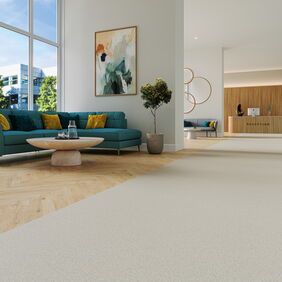 Light oak effect flooring laid in parquet style in a reception waiting area