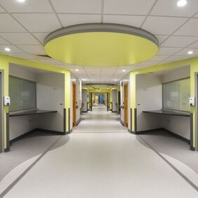 Grey and white flooring in a large hospital corridor