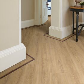 Hallway featuring light wood effect Sienna Oak flooring laid with a cross grain marquetry strip border