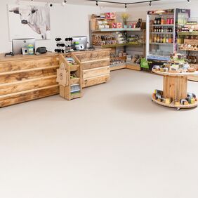 Neutral colour safety flooring in a farm shop