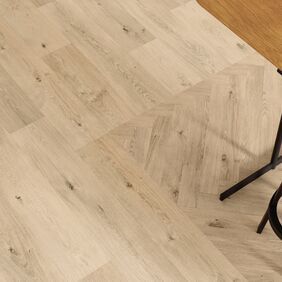 Oak effect flooring laid in straight plank and parquet