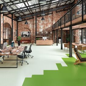 Modern construction style office with green coloured flooring 