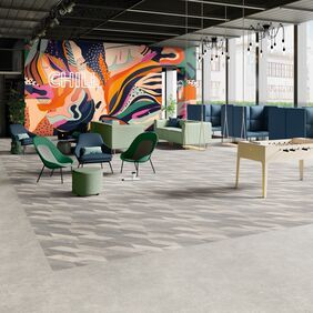 Large break out room with grey cement effect flooring