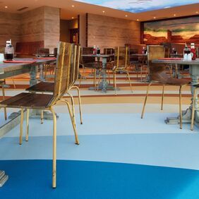 Multi blue shaded flooring laid in a restaurant with a beach theme