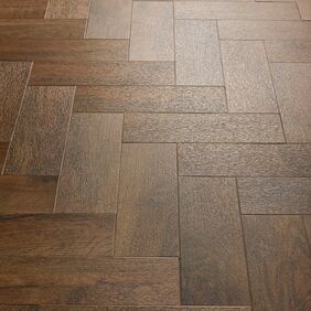 Close up of detail of the Georgian Parquet dark wood effect flooring 