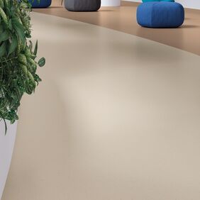 corridor with neutral coloured flooring and blue chairs