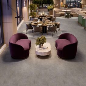 Dark concrete effect flooring laid in a bar seating area