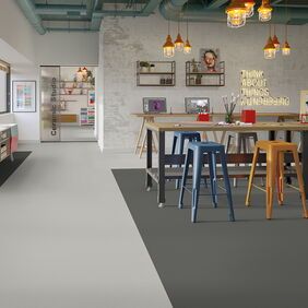 grey flooring on an education environment with stools 