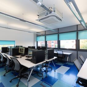 Classroom with computer and mixed blue flooring