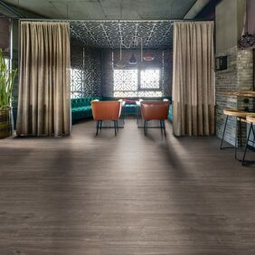 Dark oak effect flooring a in a trendy restaurant