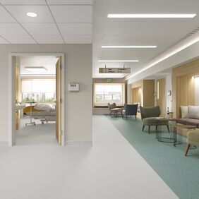 Green safety flooring in a hospital ward seating area
