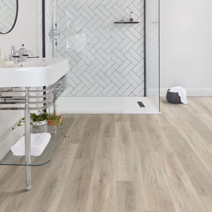 Bathroom, clear glass shower, tiles, mirror, sink 
