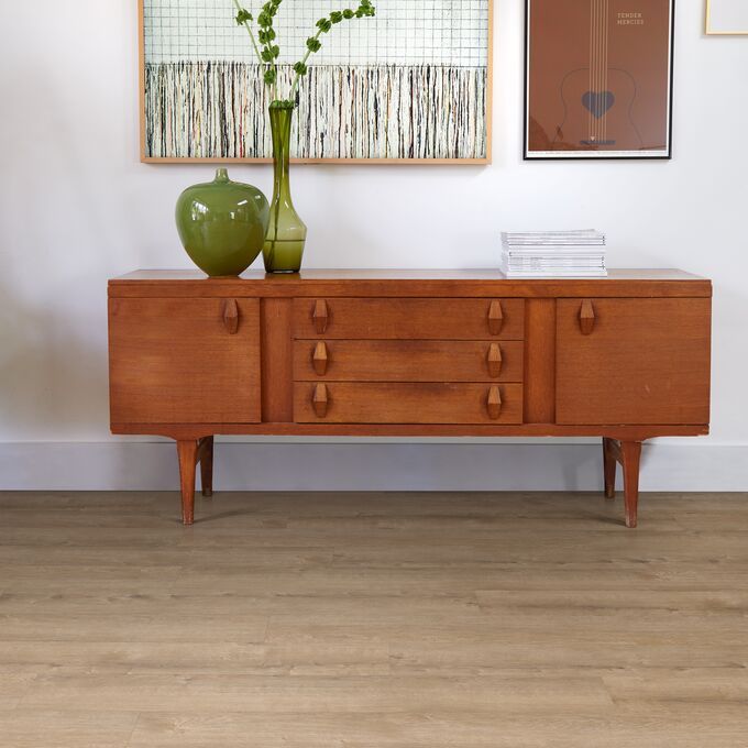 Console table, vase, pictures, wood floor