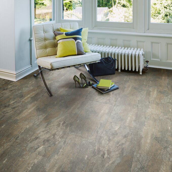 Seating area featuring slate effect flooring laid in a brickwork style in Ocean Slate 