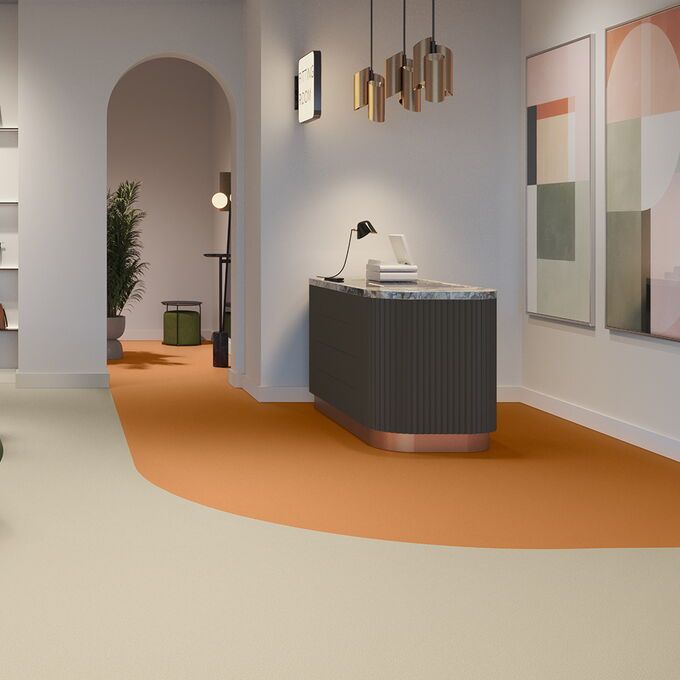 orange and cream floor in a bag shop, green chair, retail 