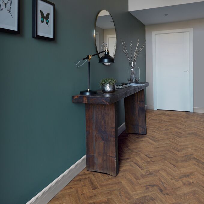 Rustic table console, Mirror, pictures. dark wood parquet flooring 