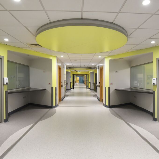 Grey and white flooring in a large hospital corridor