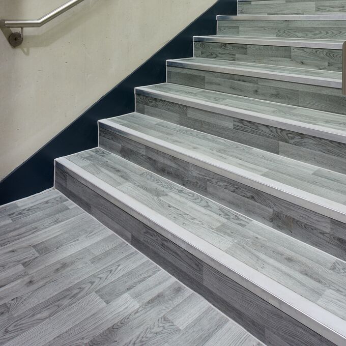 Silver oak wood effect flooring on a staircase in a highschool