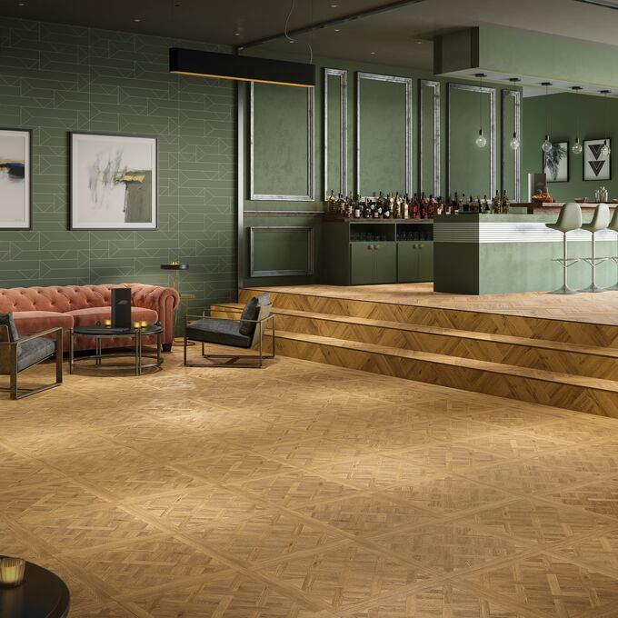 Oak effect flooring laid in a large open plan front room / kitchen