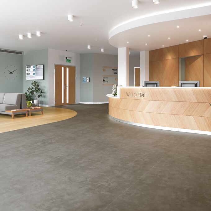 Grey concrete effect safety flooring in a doctors surgery waiting area