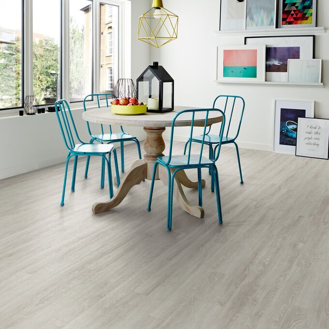 Dining room space with table and chairs with light wood effect Bianco Oak flooring 