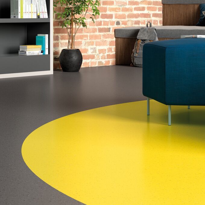 Grey and yellow flooring laid in a modern office space