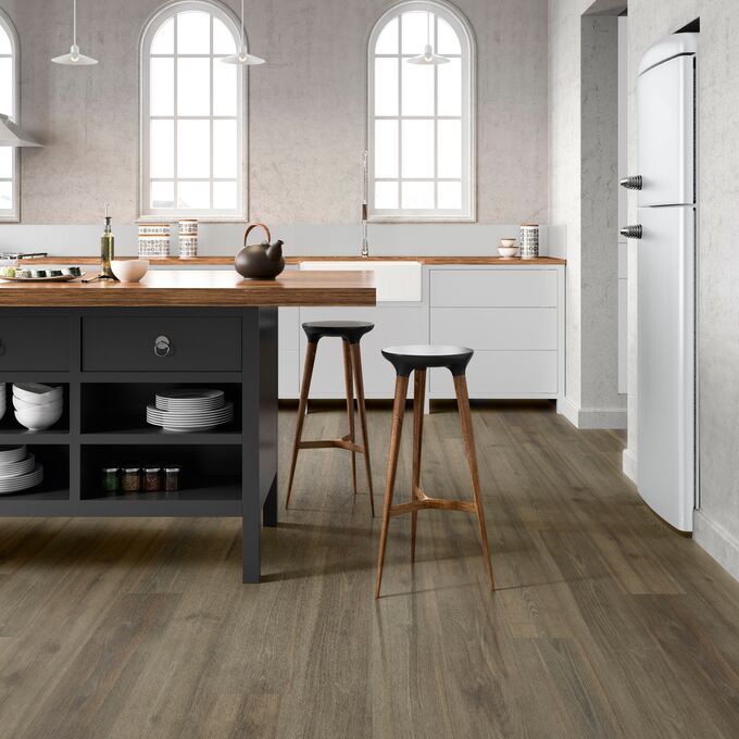 Oak effect flooring straight laid in a large kitchen