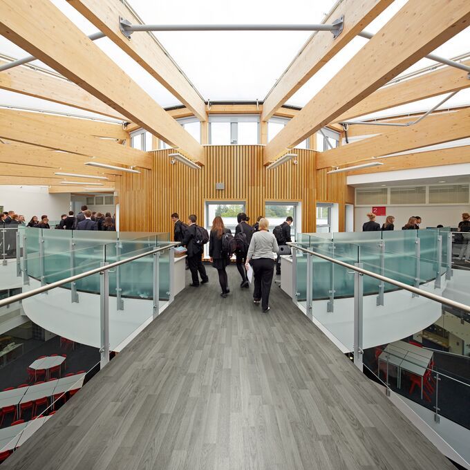 Silver oak wood effect safety flooring in a high school walkway