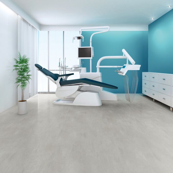 Light grey concrete effect flooring in a dentist examination room
