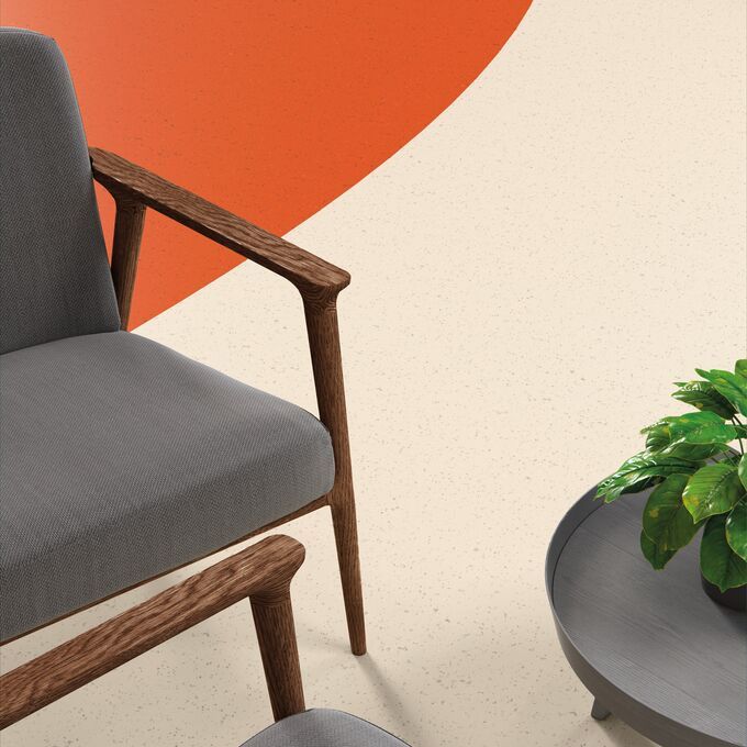 Cameo image of mixed shade flooring and grey chairs