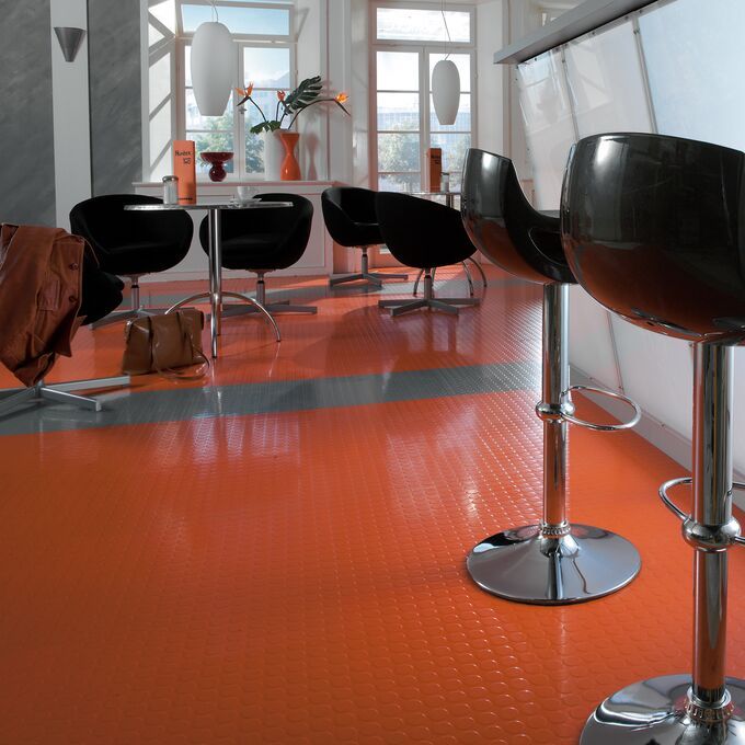 Cafe with seating and warm red coloured flooring