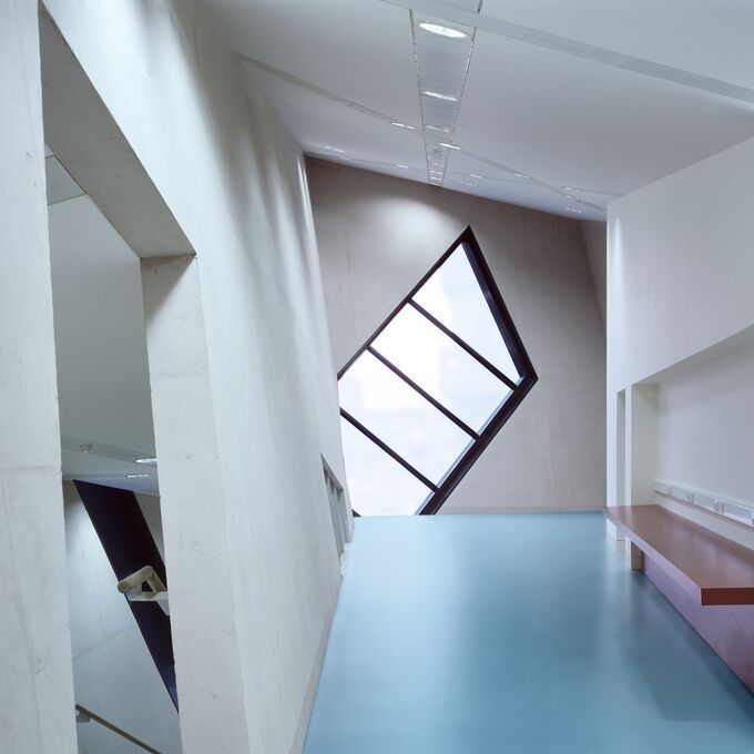 Quirky corridor area with a bench and light blue flooring