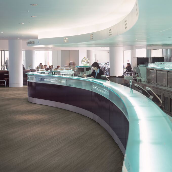 Reception area with dark wood effect flooring 